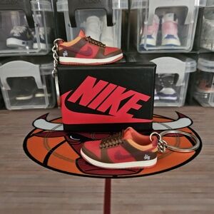 Nike SB pair of mini sneakers keychain.